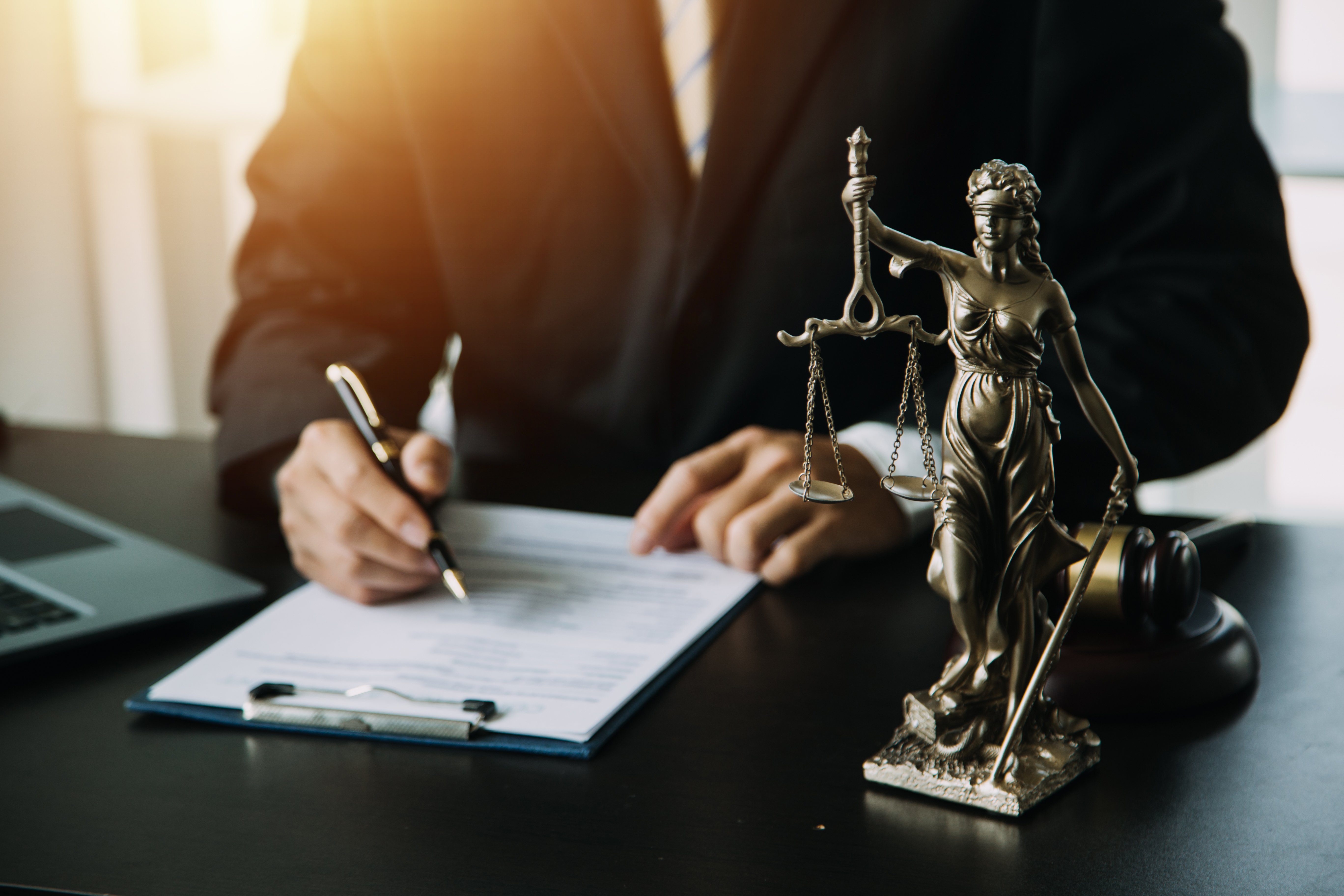 business-lawyers-discussing-contract-papers-with-brass-scale-desk-office-law-legal-services-advice-justice-law-concept-picture-with-film-grain-effect